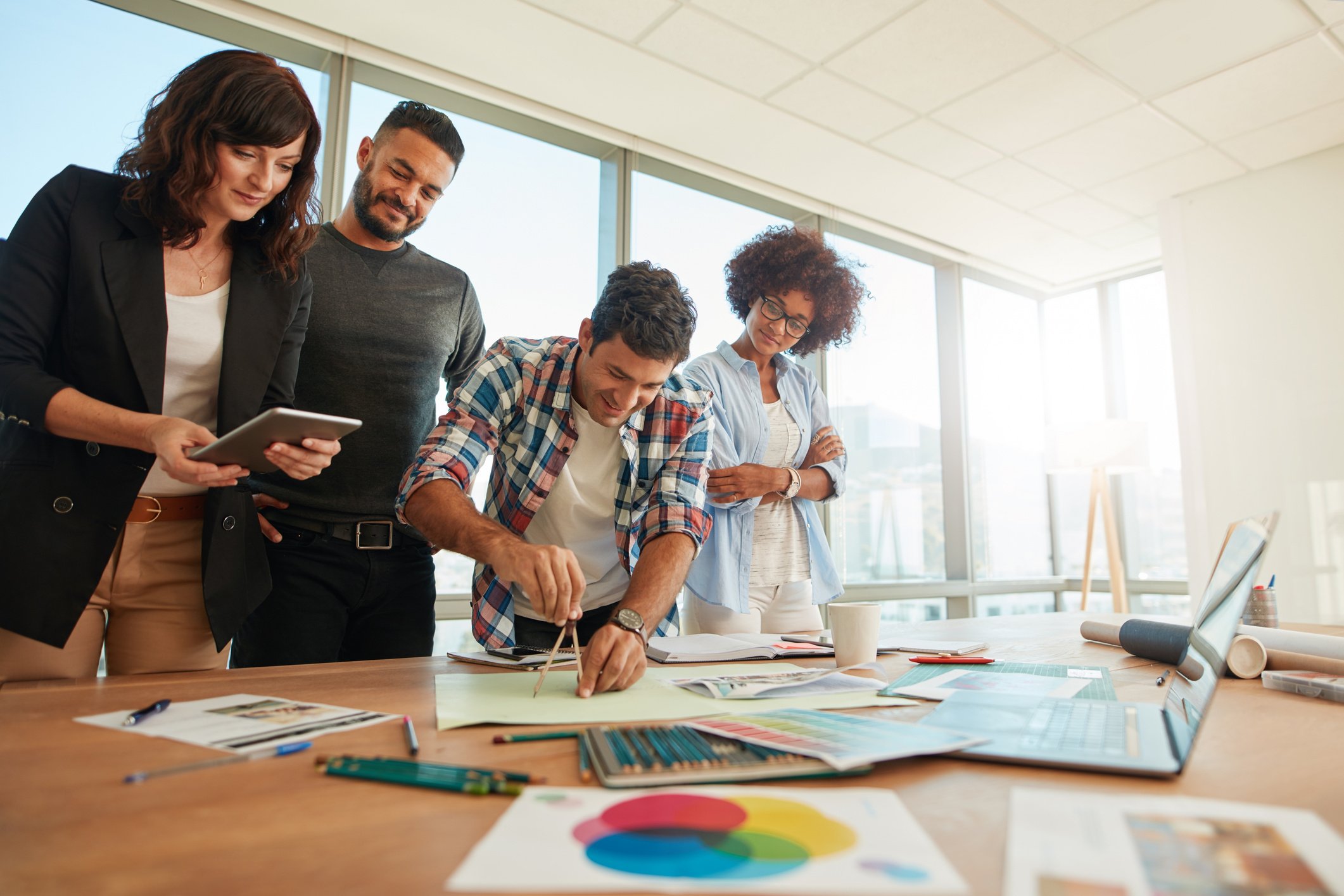 Team of Professionals Working Together in Creative Office